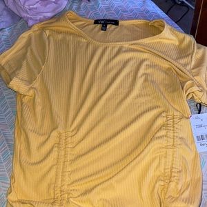 a yellow shirt bran new with tags